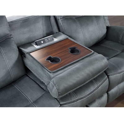 Un ensemble de canapés avec une table déroulante et un tiroir et une boîte de rangement, en vinyle gris.
