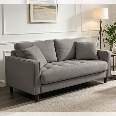 Un ensemble de canapés en 3 pièces avec des oreillers en tissu gris